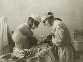 Old photo of doctors operating 