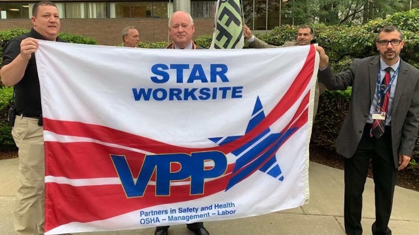 Men holding a flag